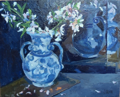 This is a small oil painting of Talavera vase with almond blossoms